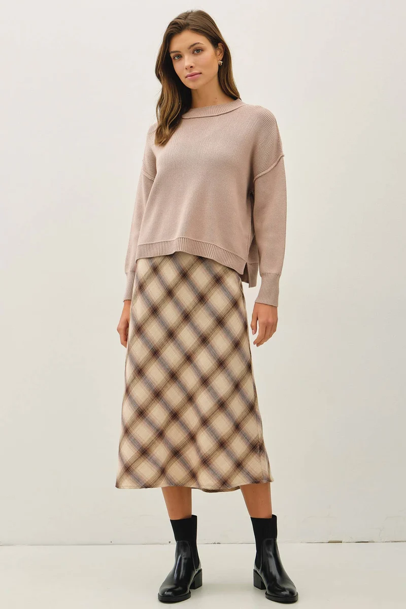 Ribbed knit sweater with raw seam details