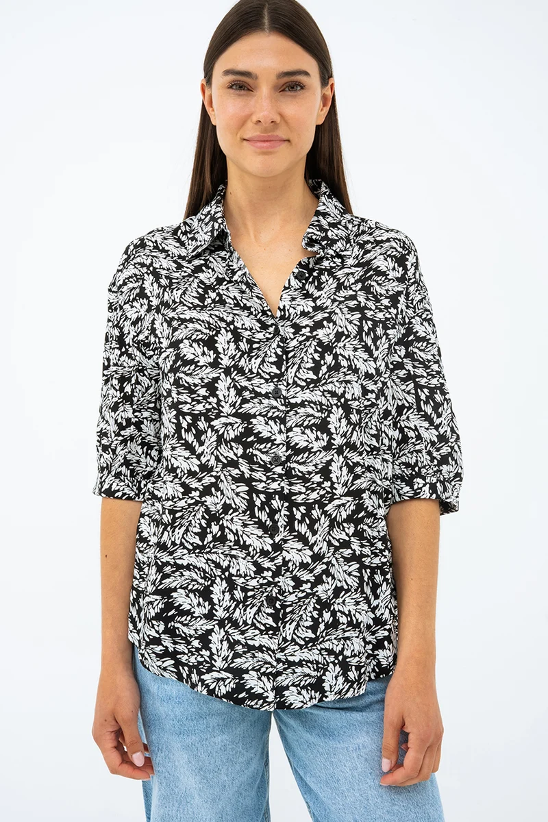 La blouse imprimée manches ballon bouton assorti