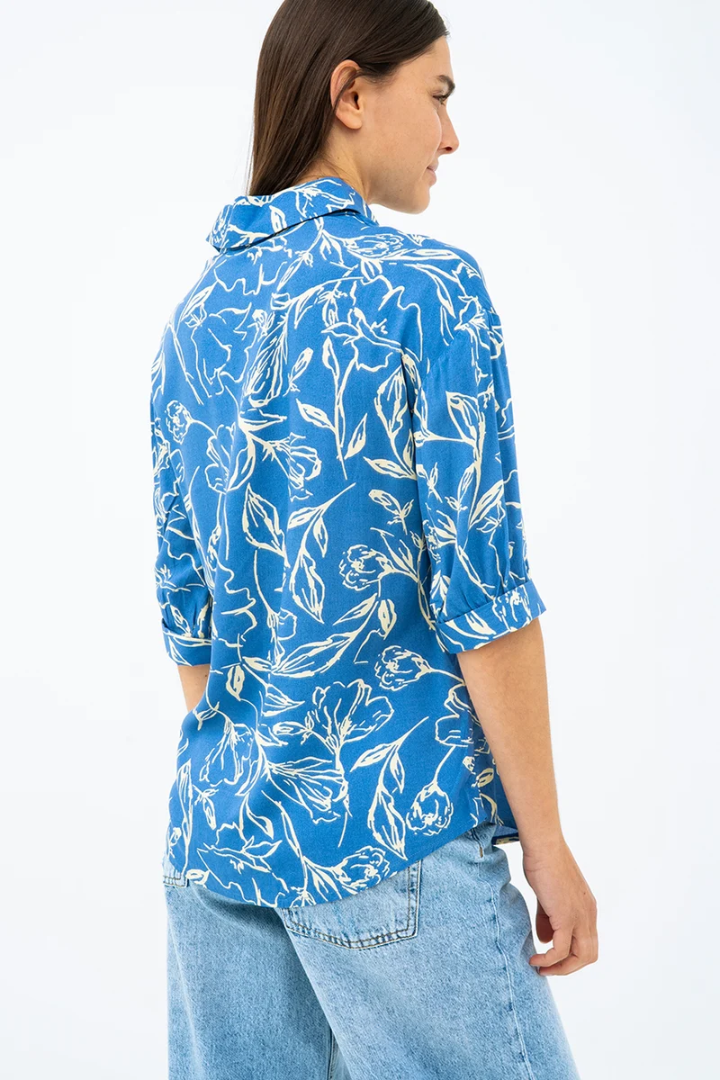 La blouse imprimée manches ballon bouton assorti
