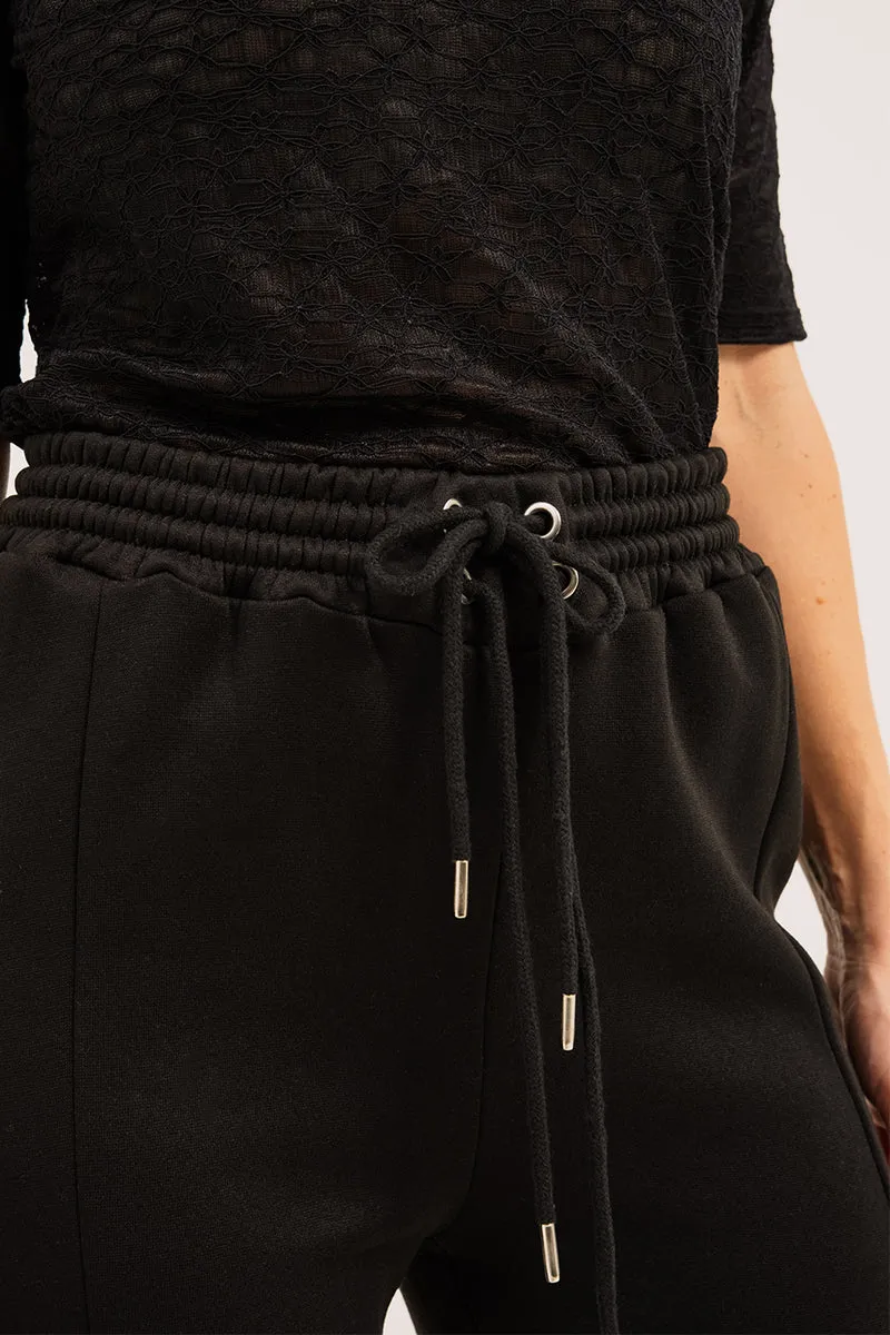 Le pantalon jambe large noir