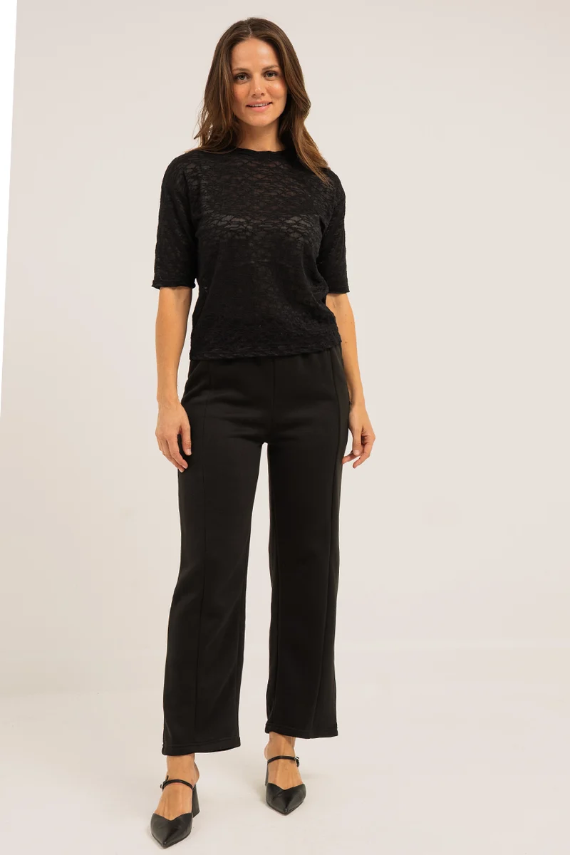 Le pantalon jambe large noir