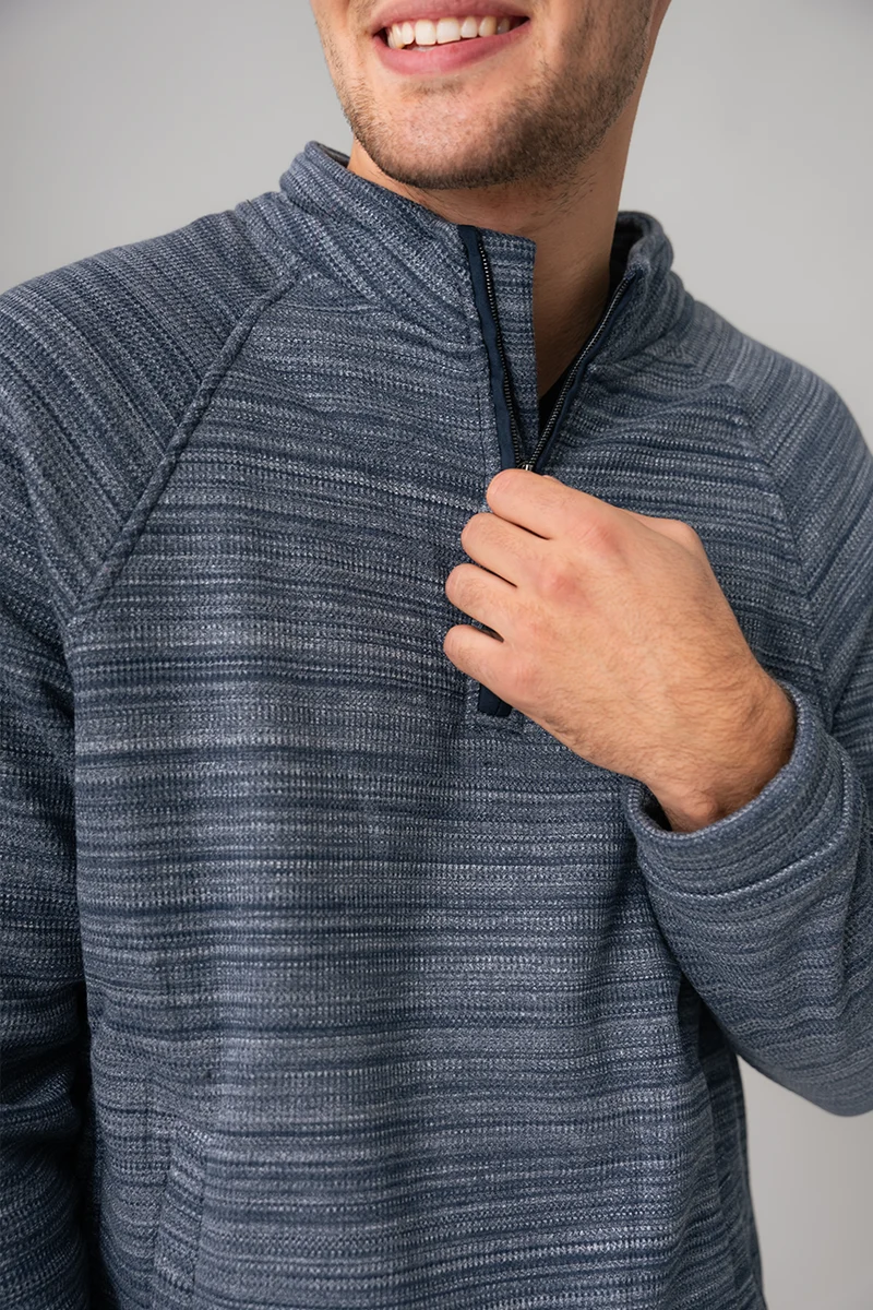 Le chandail demi-zip doublé de molleton