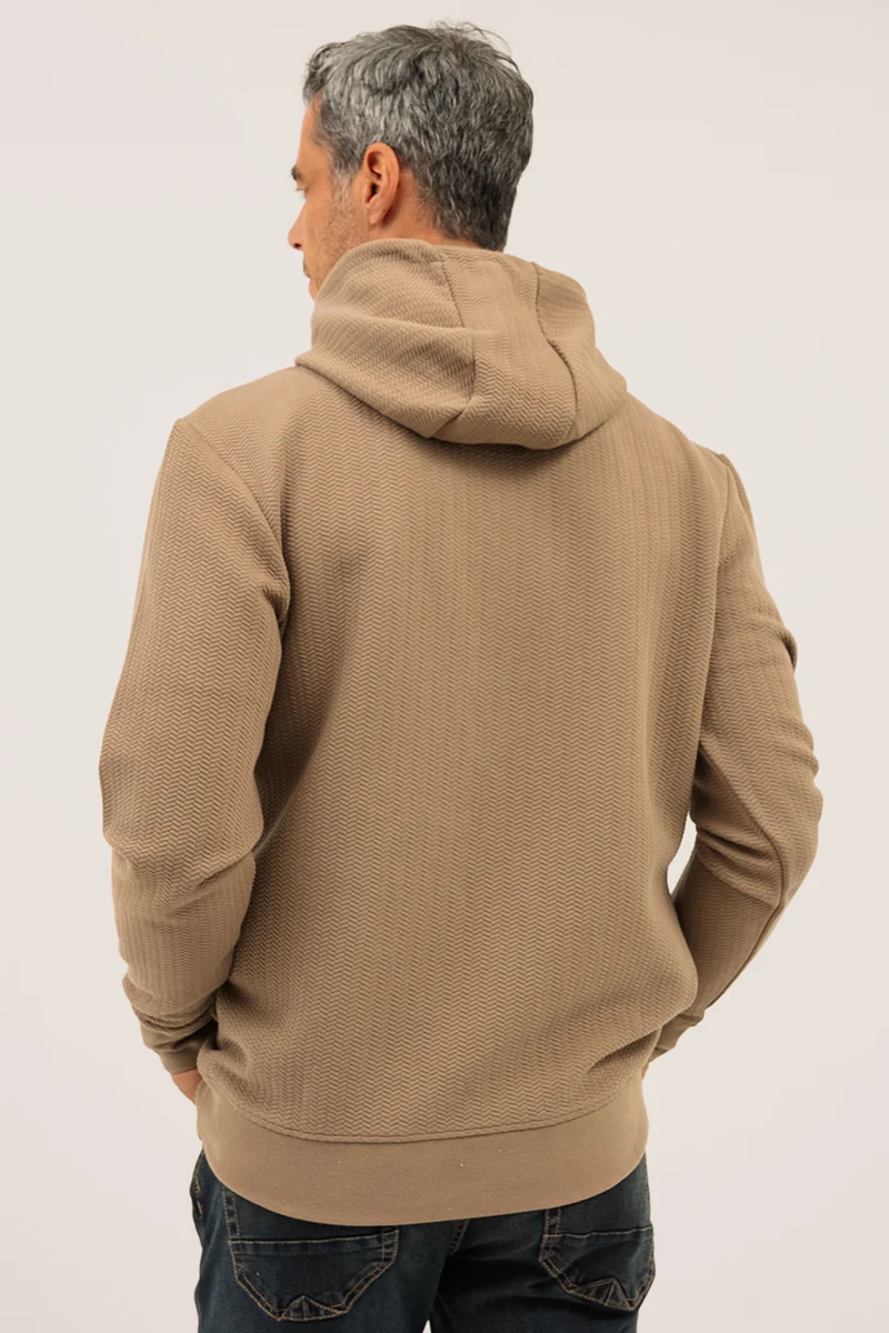 Le chandail à capuchon texturé extensible