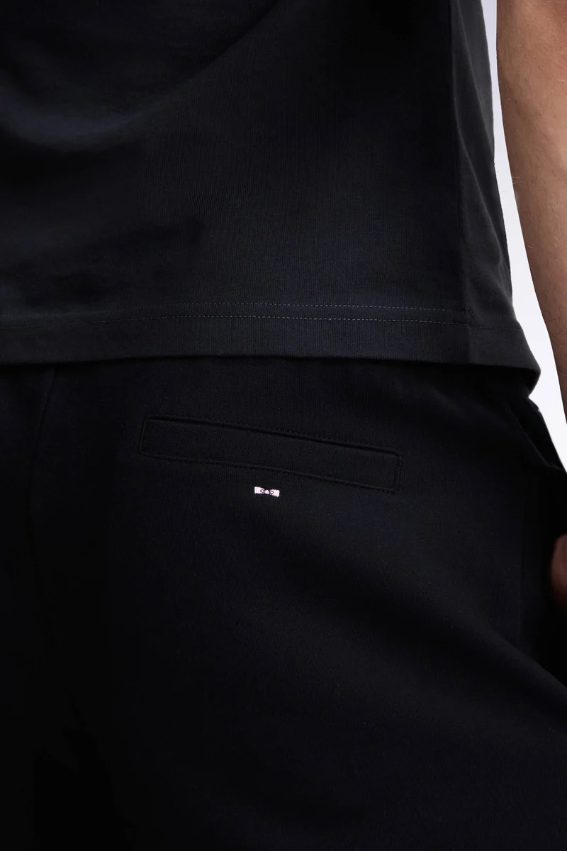 Jogging en interlock de coton stretch noir coupe droite
