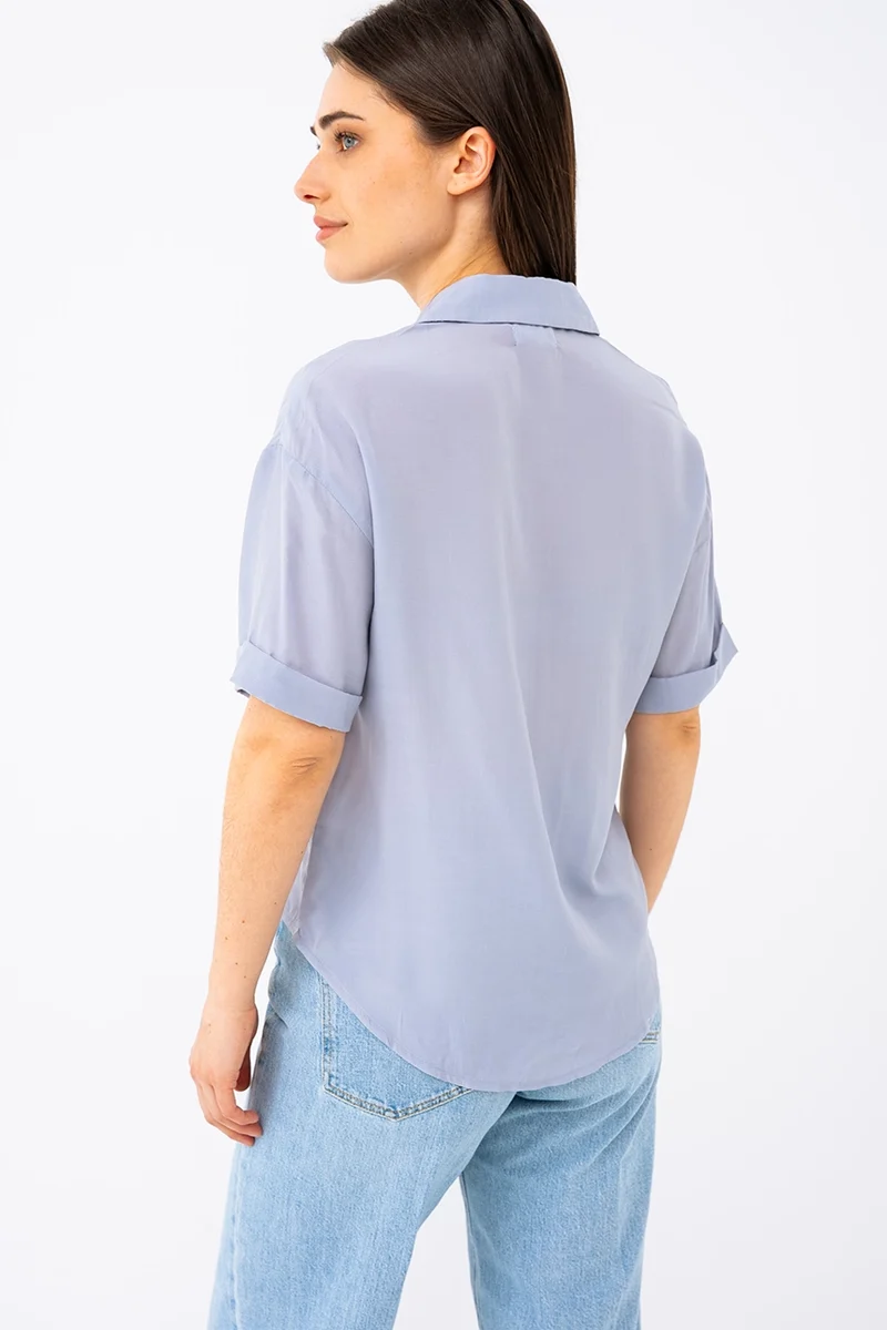 La blouse courte unie